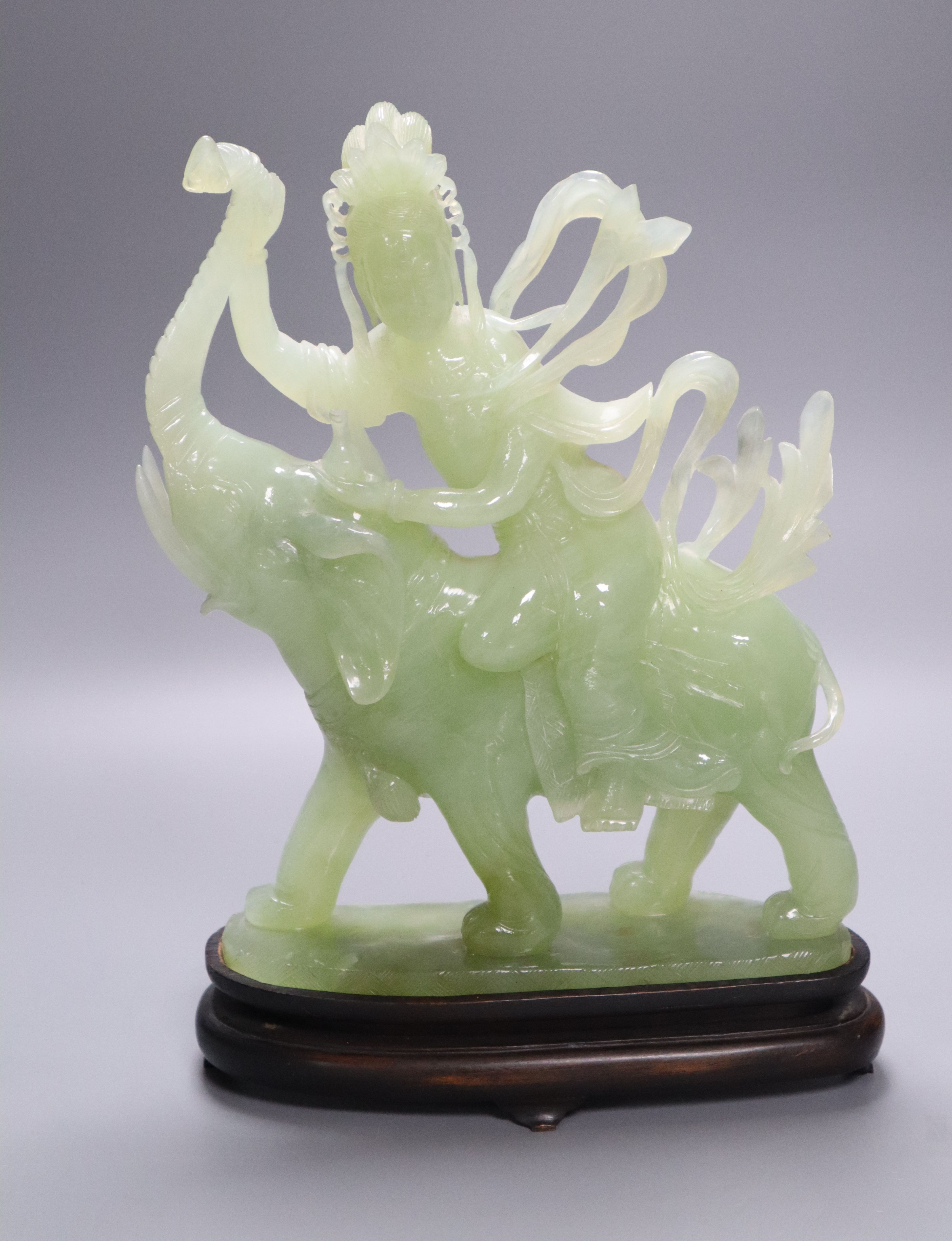A green bowenite rider on elephant on stand, 27cm high